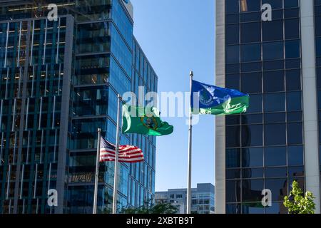 The national flag of the United States, flag of Washington and Flag of the City of Bellevue are seen in Bellevue, WA, United States. Stock Photo