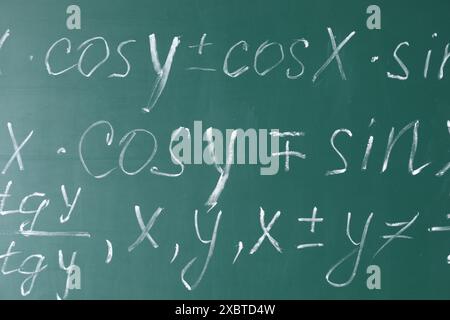 Many different math formulas written on chalkboard Stock Photo