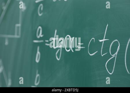 Many different math formulas written on chalkboard Stock Photo