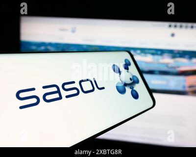 Smartphone with logo of South African energy company Sasol Limited in front of business website. Focus on center-left of phone display. Stock Photo