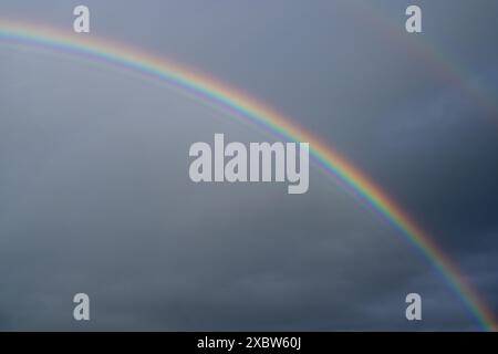 Low angle view to sky with rainbow Stock Photo