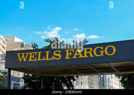 Washington DC, USA - 2 May 2024: Sign above the entrance to a branch of the Wells Fargo bank in downtown Washington DC Stock Photo