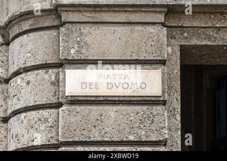 Street sign of Piazza del Duomo (Cathedral Square), the main square of Milan, on the stone facade of a building, Lombardy, Italy Stock Photo