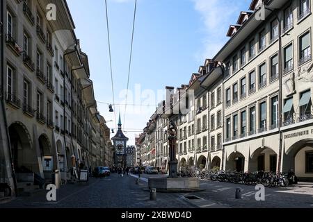 Cityscape of Bern, de facto capital of Switzerland, showcasing the Zytglogge clock tower and the city's medieval covered shopping promenades (Lauben). Stock Photo