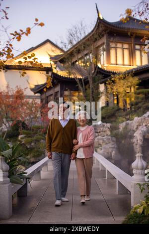 Senior Couple Taking a Walk in Park Stock Photo