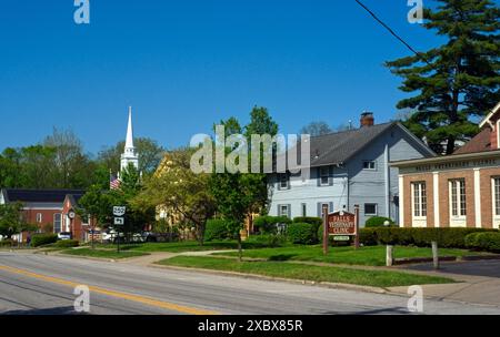 Columbia Street is the main highway through this Cleveland suburb and passes by businesses and a church of an old-tiime character. Stock Photo