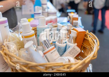 Osijek Croatia - 7 06 2024: Health and Beauty Fair. Wicker Basket Filled With Skincare Products at a Trade Show Stock Photo