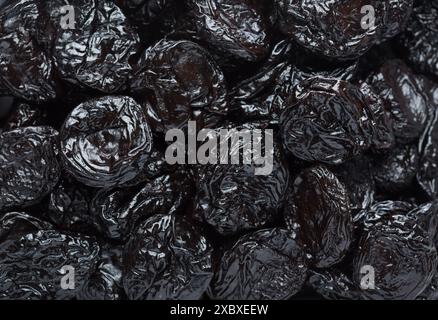 Close-up of Prunes (dried Prune Plums) as background. Selective focus. Flat lay Stock Photo