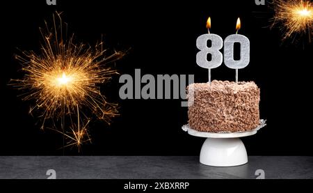 Birthday celebration with cake and candle number 80 Stock Photo