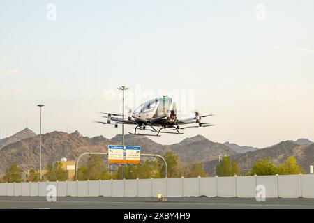 (240613) -- MECCA, June 13, 2024 (Xinhua) -- Photo taken on June 12, 2024 shows an unmanned air taxi during a test trial in Mecca, Saudi Arabia. Saudi and Chinese companies have carried out a successful test trial of the first unmanned air taxi in Mecca, Saudi Arabia. The demonstration was carried out on Wednesday by the Front End Limited Company, a Saudi firm specializing in integrating advanced technology across various sectors, in partnership with EHang, a Chinese autonomous aerial vehicle technology platform company. (Front End Limited Company/Handout via Xinhua) Stock Photo