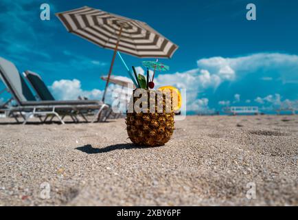 Pineapple cocktails at summer beach. Summer vacation. Stock Photo