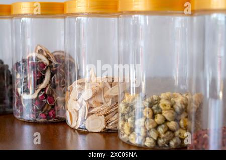 Astragalus Mt aceus slices in a bottle. Chinese herbal material. Stock Photo