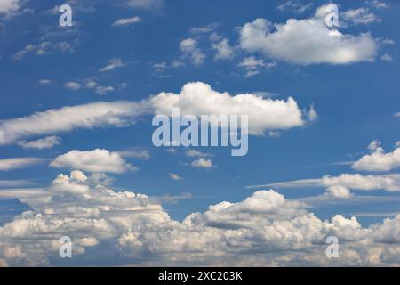 Beautiful sky landscape. Fancy clouds float across the sky. Copy space. Stock Photo