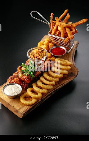 beer snacks on a wooden board. Stock Photo