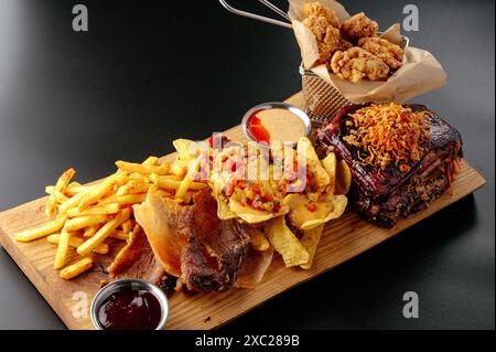 beer snacks on a wooden board. Stock Photo