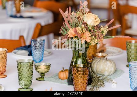 Autumn table setting with vintage drink-wear and plates Stock Photo