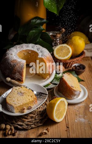 View of bundt with sugar falling on table Stock Photo