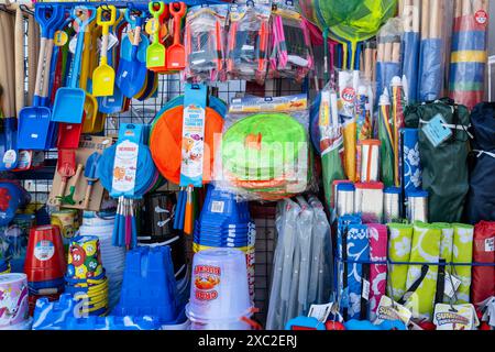 plastic buckets spades beach toys beach novelties on display outside a shop in Newquay Town Centre in Cornwall in the UK. Stock Photo