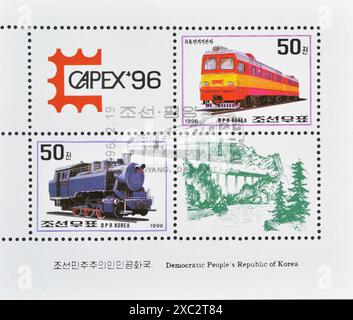 Souvenir Sheet with cancelled postage stamp printed by North Korea, that show Locomotives and promotes CAPEX '96, Toronto:, circa 1996 Stock Photo