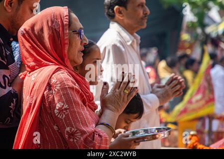 Kashmiri Pandit (Hindu) devotees pray during the annual Hindu festival Mata Kheer Bhawani Mela at the Kheer Bhawani Temple in the Tullamulla area of Ganderbal district, about 30 kilometres northeast of Srinagar. Amid tight security, thousands of Kashmiri Hindus, many of whom were displaced 25 years ago, attended the festival to pay homage to the Hindu goddess Mata Kheer Bhawani on her birth anniversary. Some 200,000 Kashmiri Pandits fled the Himalayan disputed region in the early 1990s at the start of an insurgency against Indian rule, mainly to the Hindu-dominated southern city of Jammu, and Stock Photo