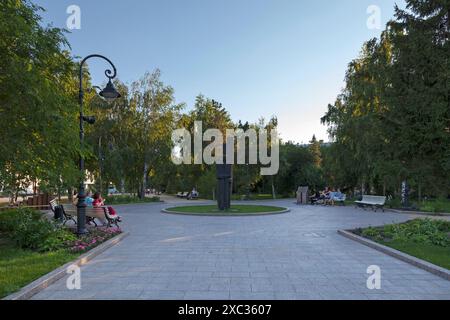 Omsk, Russia - July 17 2018: Theater Garden with in its middle, the Monument to the famous Russian writer F.M. Dostoevsky 'Carrying Cross'. Stock Photo