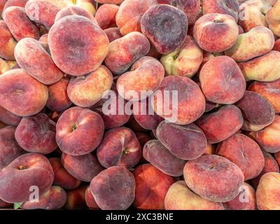 Donut peaches as background, full frame of Saturn peaches, texture in top view Stock Photo