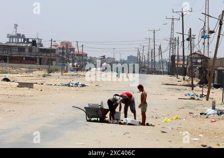 Palestinian youth lose some equipment and empty ammunition left by the Israeli army in along a street in the western part of Rafah Palestinian youth lose some equipment and empty ammunition left by the Israeli army in along a street in the western part of Rafah in the southern Gaza Strip on June 14, 2024 Photo by Omar Ashtawy apaimages Rafah Gaza Strip Palestinian Territory 140624 Rafah OSH 0015 Copyright: xapaimagesxOmarxAshtawyxxapaimagesx Stock Photo