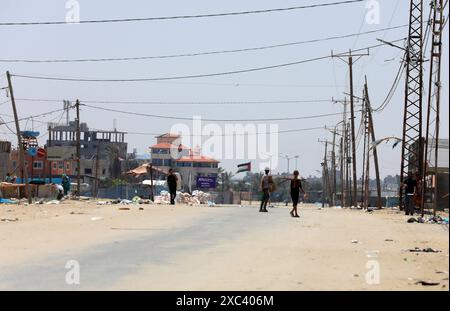 Palestinian youth lose some equipment and empty ammunition left by the Israeli army in along a street in the western part of Rafah Palestinian youth lose some equipment and empty ammunition left by the Israeli army in along a street in the western part of Rafah in the southern Gaza Strip on June 14, 2024 Photo by Omar Ashtawy apaimages Rafah Gaza Strip Palestinian Territory 140624 Rafah OSH 0016 Copyright: xapaimagesxOmarxAshtawyxxapaimagesx Stock Photo