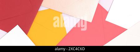 Banner with multicolored envelopes scattered on a blue background. Stock Photo
