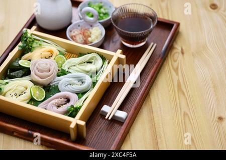 Japanese thin noodles made of wheat, called somen.  Chilled summer food. with pork shabu shabu. Stock Photo