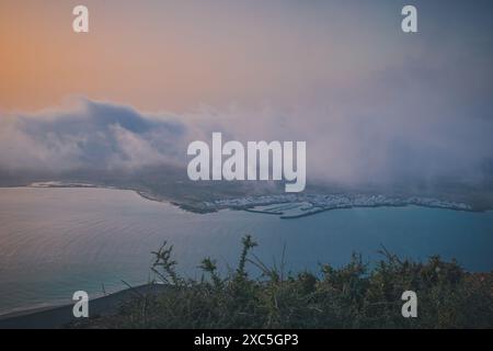 Low clouds above La Graciosa island during the sunset, Lanzarote Stock Photo