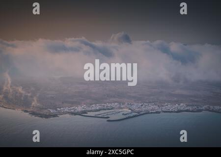 View from Mirador del Rio on La Graciosa island port at evening, Lanzarote Stock Photo