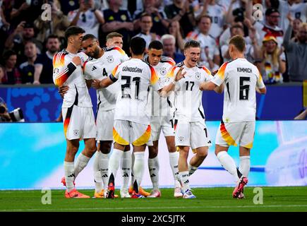 Germany's Florian Wirtz celebrates with team-mates after scoring their ...