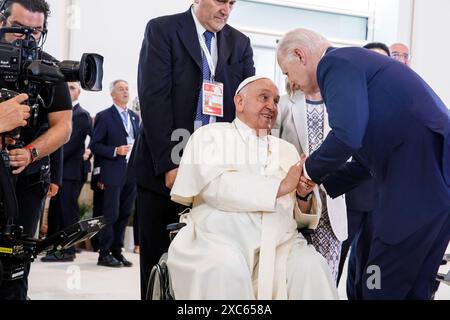 Apulia, Italy. 14th June, 2024. U.S President Joe Biden, right, greets Pope Francis, during a special session of the G7 Summit at the Borgo Egnazia resort, June 14, 2024, in Savelletri di Fasano, Italy. Pope Francis became the first pope to address the annual gathering of the Group of Seven nations. Credit: Presidenza del Consiglio/G7 Italia 2024/Alamy Live News Stock Photo