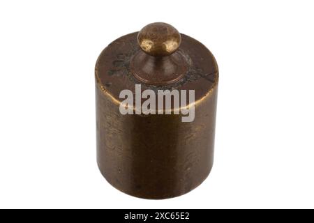 Old rusty bronze scale weights isolated on white Stock Photo