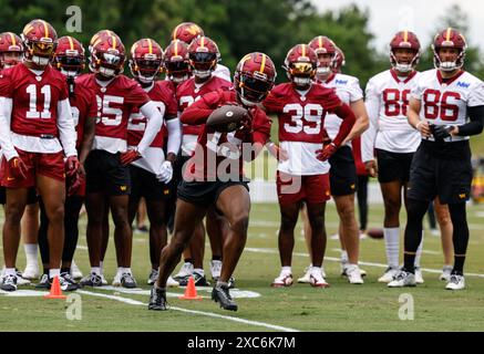 Washington Commanders cornerback Noah Igbinoghene (19) performing drills at mini camp at the OrthoVirginia Training Center at Commanders Park in Ashburn VA on June 11 2024 (Alyssa Howell for Image of Sport) Stock Photo