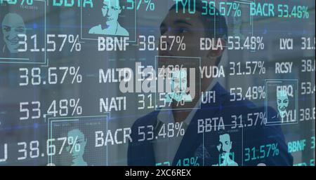 Image of stock market data processing over thoughtful biracial businessman at office Stock Photo