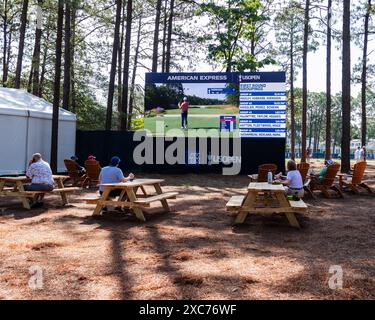 Pinehurst, North Carolina, USA. 13th June, 2024. Fans watch the action in the American Express Food Village along the second fairway during Thursday's first round for the 124th U.S. Open, June 13, 2024, at Pinehurst Resort & Country Club (Course No. 2) in Pinehurst, North Carolina. (Credit Image: © Timothy L. Hale/ZUMA Press Wire) EDITORIAL USAGE ONLY! Not for Commercial USAGE! Stock Photo