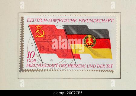 Stamp German-Soviet friendship with national flags of the Soviet Union and the GDR, GDR, German Democratic Republic, Germany Stock Photo