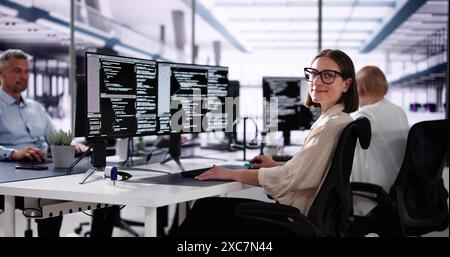 African American Coder Using Computer At Desk. Web Developer Stock Photo