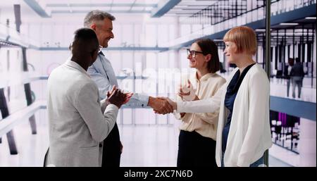 Business Executives Shake Hands. Welcoming Partners Team Stock Photo