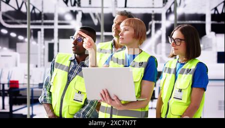 Factory Worker Osha Inspection Using Laptop Computer Stock Photo