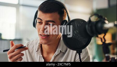 Podcast, presenter and radio show host with man speaking about public relations and live streaming. Recording, microphone and headphone with interview Stock Photo