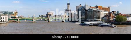 Panorama of Southwark Bridge over the River Thames in London.Tower Bridge is visible in background, as well as The Shard during construction. Stock Photo