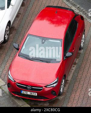 OSTRAVA, CZECH REPUBLIC - APRIL 24, 2024: Red Opel Corsa F small hatchback parked on street, top view Stock Photo