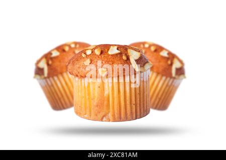 Three cupcakes floating on a white background. Stock Photo