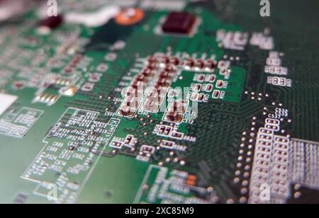 Surface mount technology resistors and connection lines on the electronic card. High-tech background with circuit board texture. Selected focus. Stock Photo