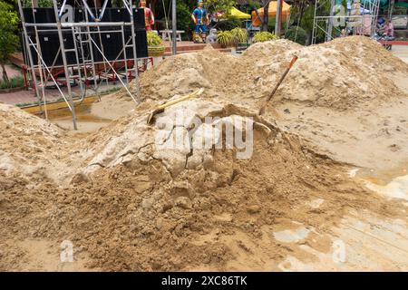 Piles of sand ready to create sand buildings at a traditional festival ...