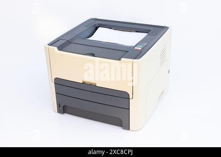 Printer Printing Documents on White Background Stock Photo