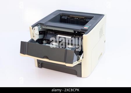 Office Printer Open for Repair Work on White Background Stock Photo